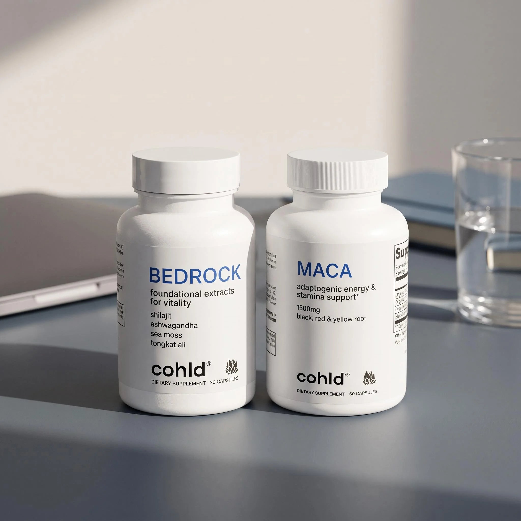 The Drive Stack — Cohld Bedrock shilajit complex and maca capsules on a home office desk in afternoon light